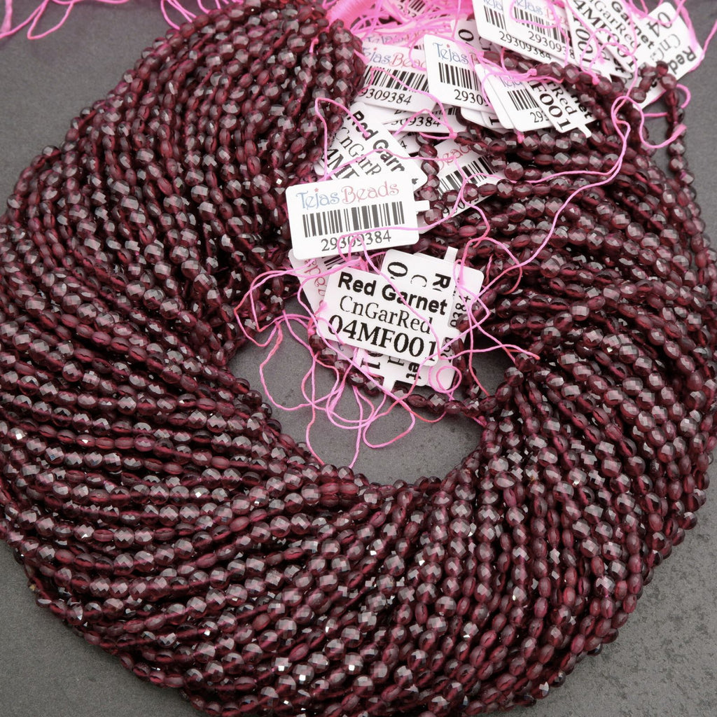 Burgundy braided hair extensions with product tags on a gray background