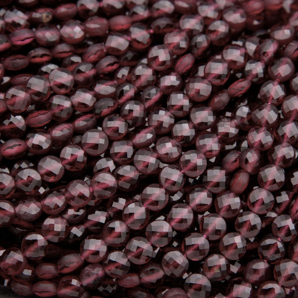 Close-up of dark red beads on a dark background
