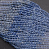 Close-up of blue beads on a dark background