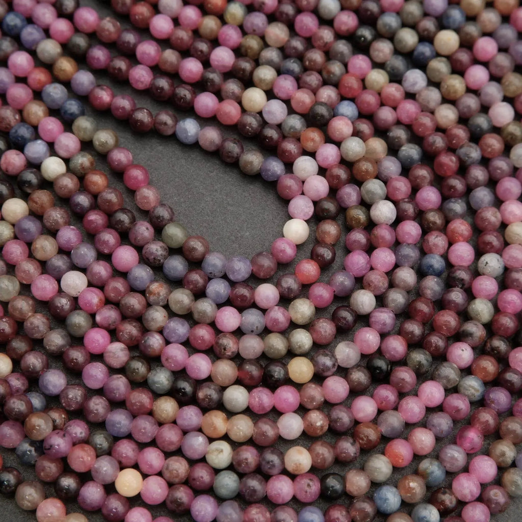 Close-up of multicolored round beads on a dark background
