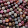 Mixed ruby and sapphire gemstone strands with rich colors and reflective surface