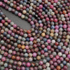 Ruby and sapphire gemstone beads with glossy finish and earthy, organic tones