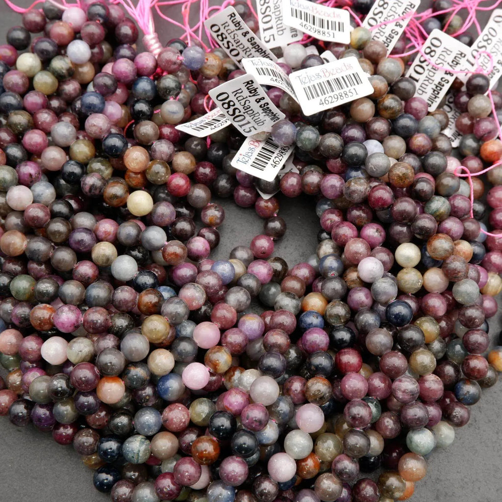Mixed ruby and sapphire gemstone strands with rich colors and reflective surface