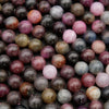 Close-up of multicolored round beads on a dark background