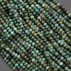 Close-up of turquoise-colored beads on a dark background