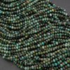 Close-up of a string of turquoise beads on a dark background