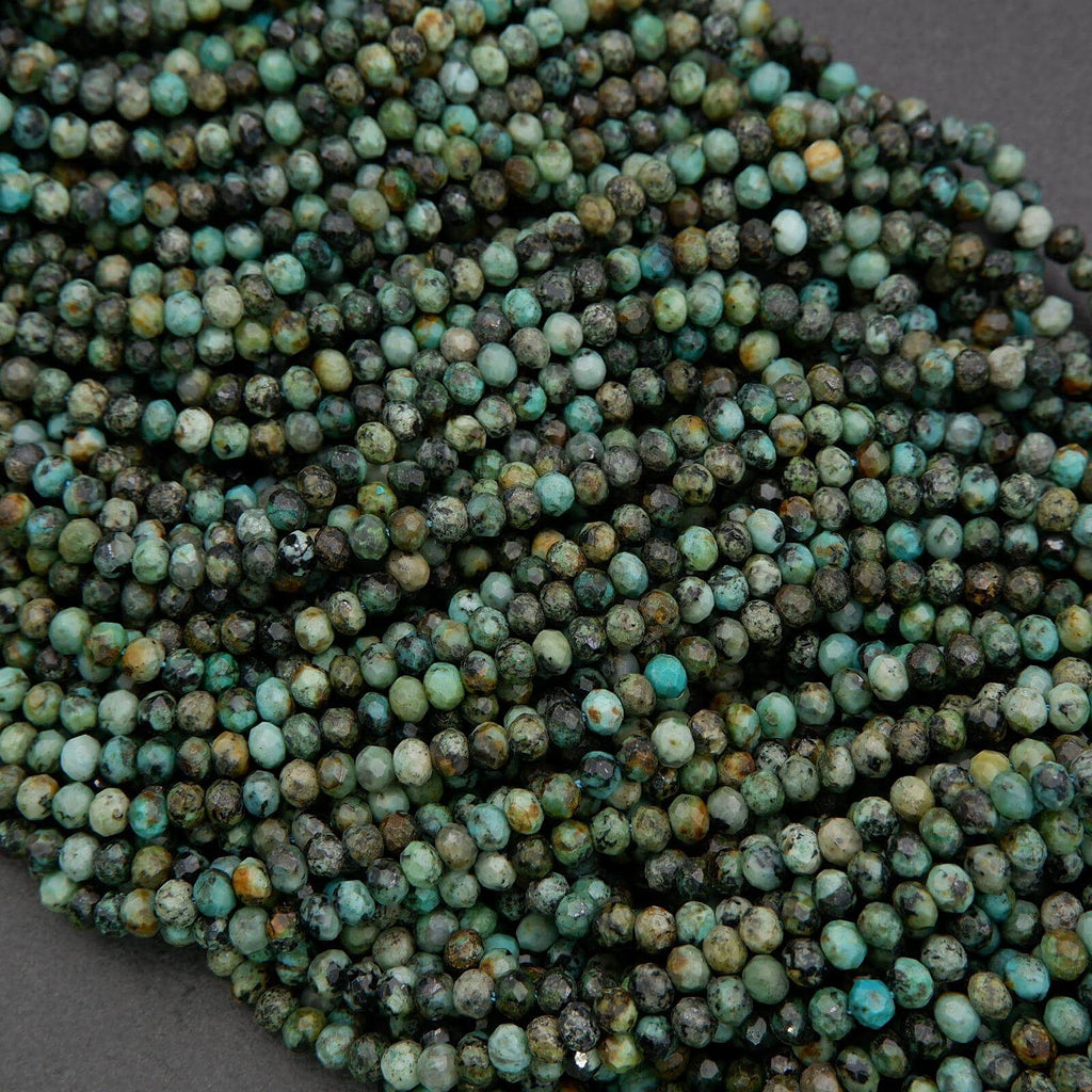 Close-up of a string of turquoise beads on a dark background
