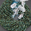 String of green beads with price tags on a gray background