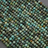Close-up of turquoise beads with a gray background