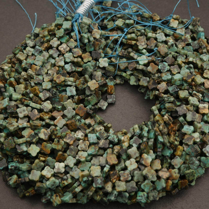 Decorative wreath made of small stone-like tiles on a brown background