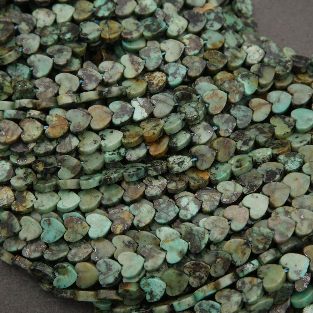 Close-up of heart-shaped turquoise beads on a string