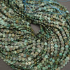 String of green heart-shaped beads on a brown surface