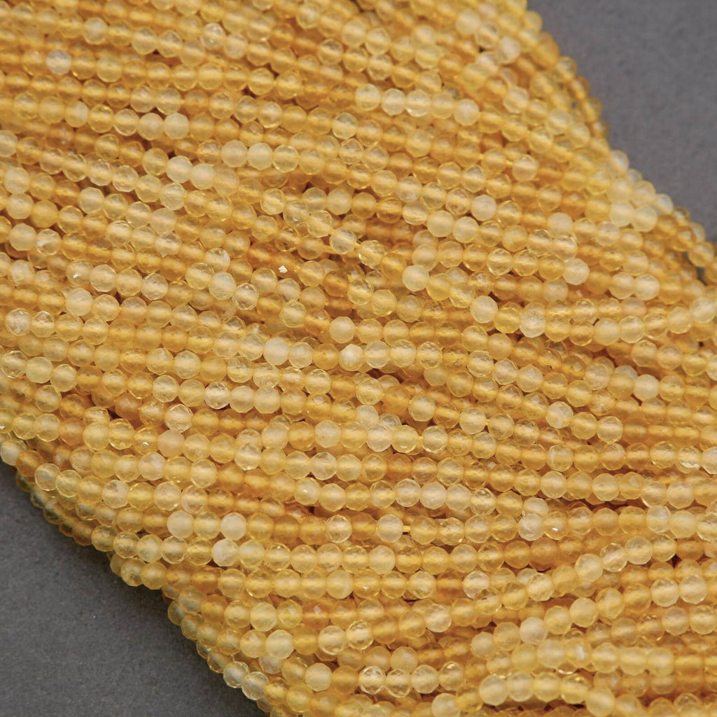 Close-up of yellow glass beads on a gray background