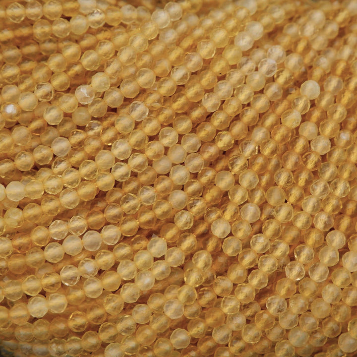 Close-up of yellow beads on a textured surface