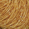 Close-up of yellow beads on a string