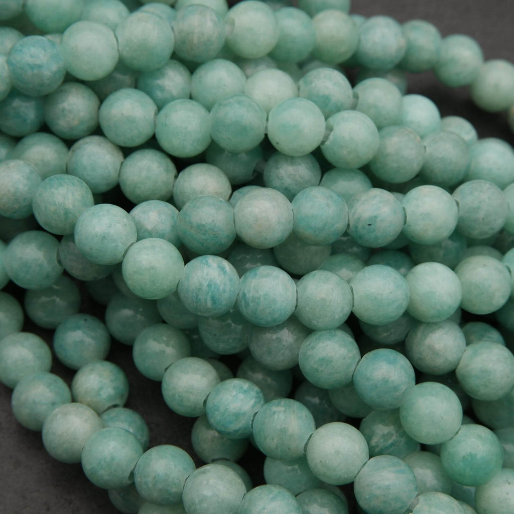 Close-up of teal beads on a dark background