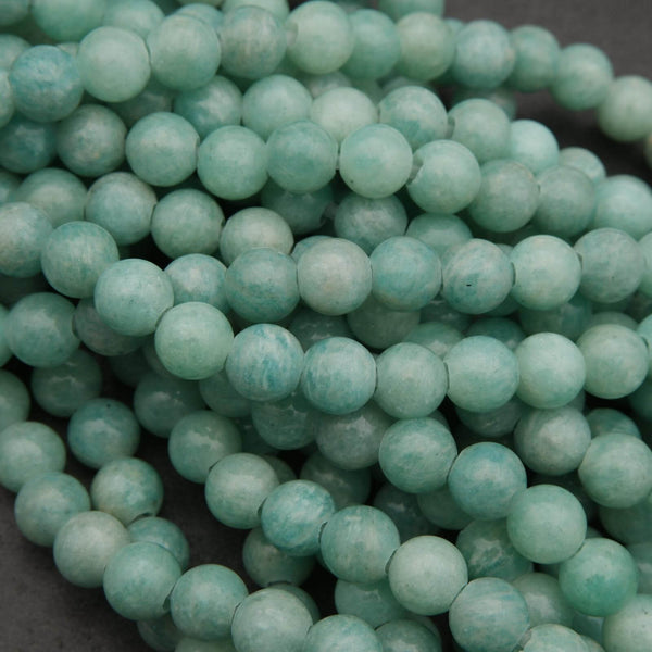 Close-up of teal beads on a dark background