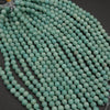 String of turquoise beads on a dark background