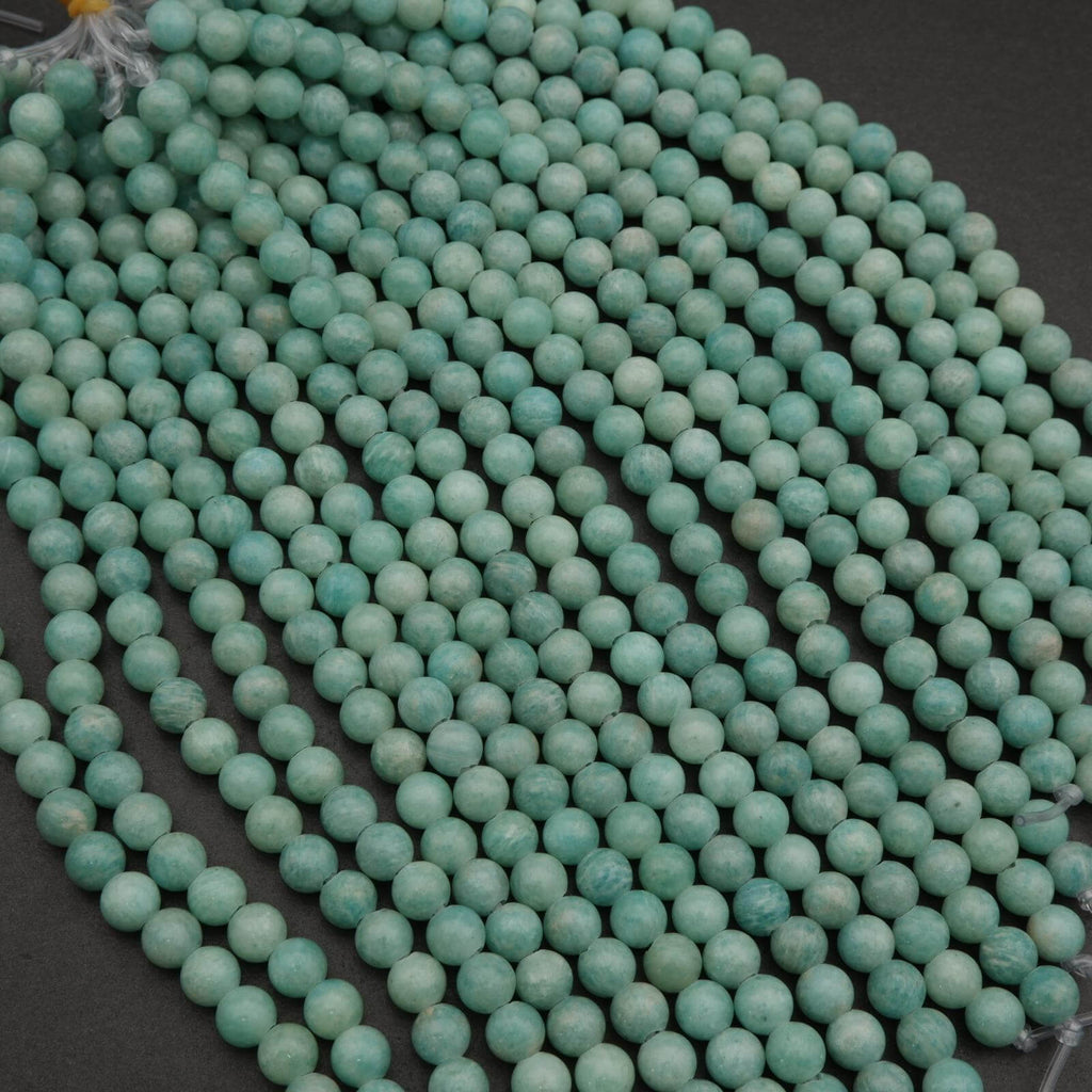 String of turquoise beads on a dark background