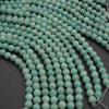 Close-up of turquoise beads on a dark background