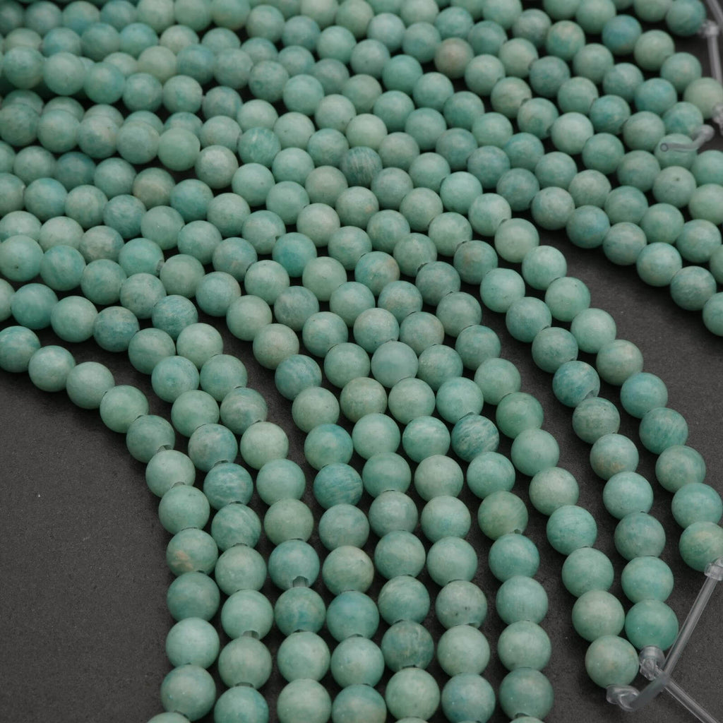 Close-up of turquoise beads on a dark background
