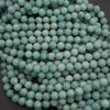 Close-up of turquoise beads on a dark background
