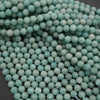 Close-up of turquoise beads on a dark background