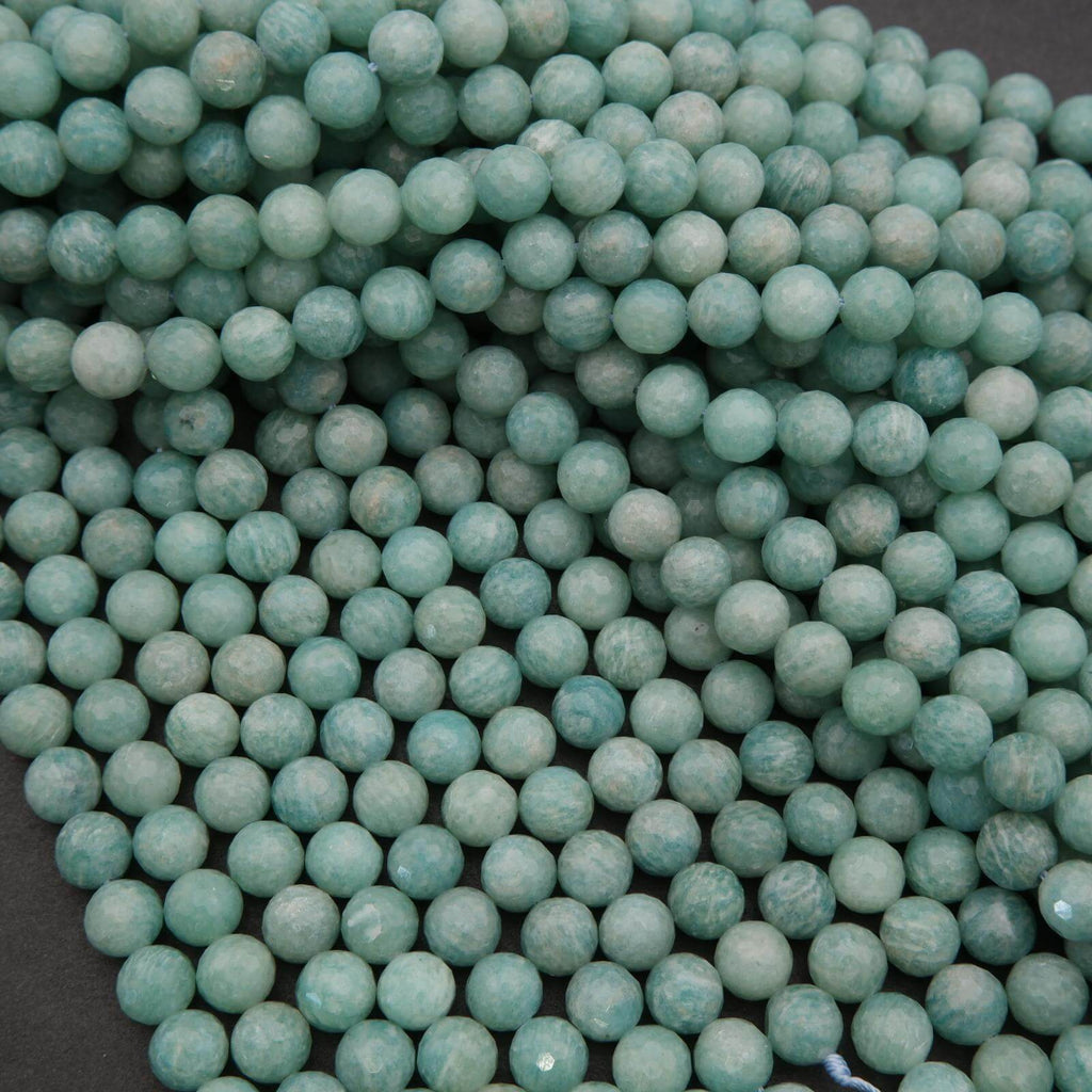 Close-up of turquoise beads on a dark background