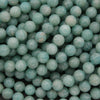 Close-up of teal-colored marbles or beads.
