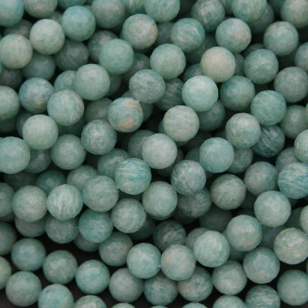 Close-up of teal-colored marbles or beads.
