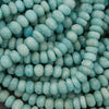 Close-up of turquoise beads with a textured surface