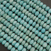 Close-up of turquoise beads on a dark background