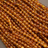 Close-up of amber-colored beads on a string