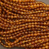 Close-up of amber-colored beads on a string