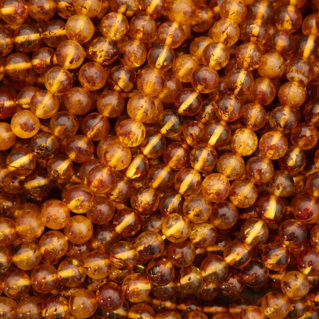 Close-up of amber-colored beads with a blurred background