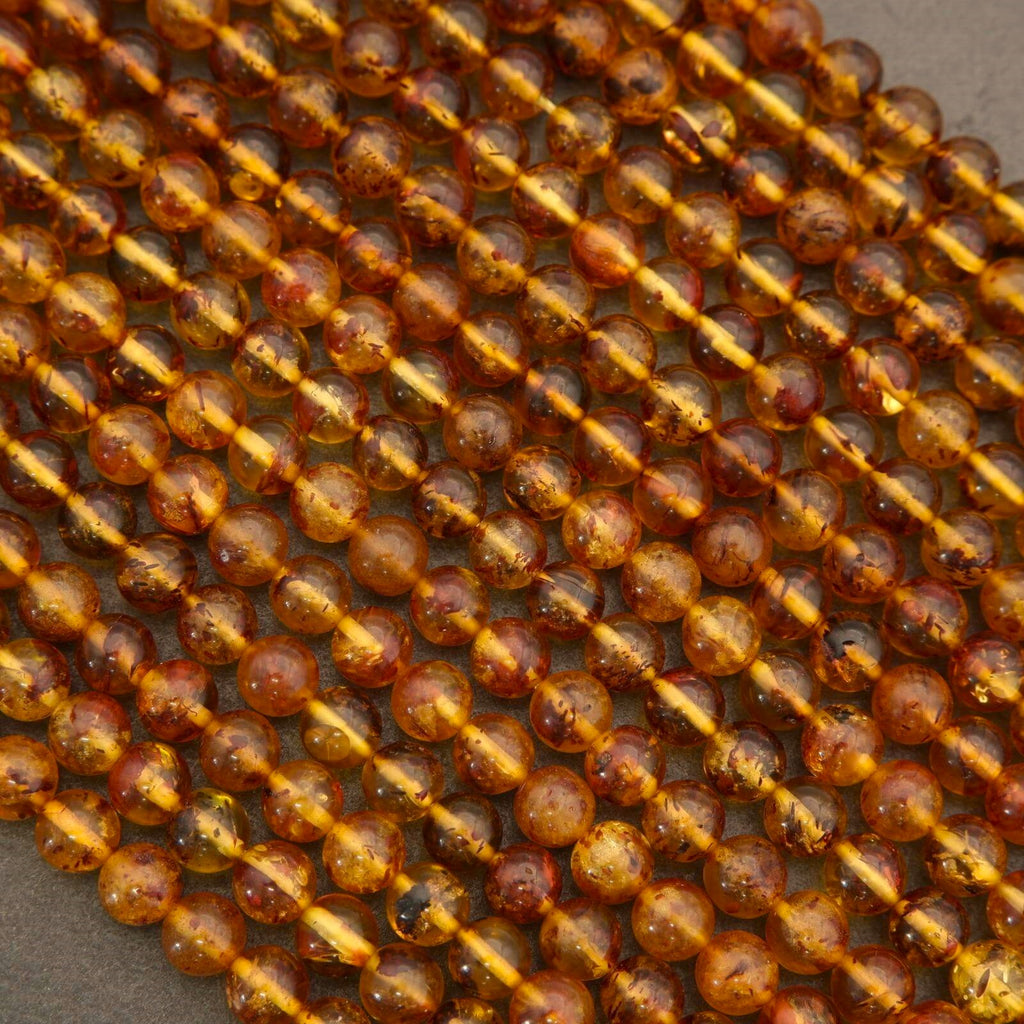 Close-up of amber-colored beads on a string