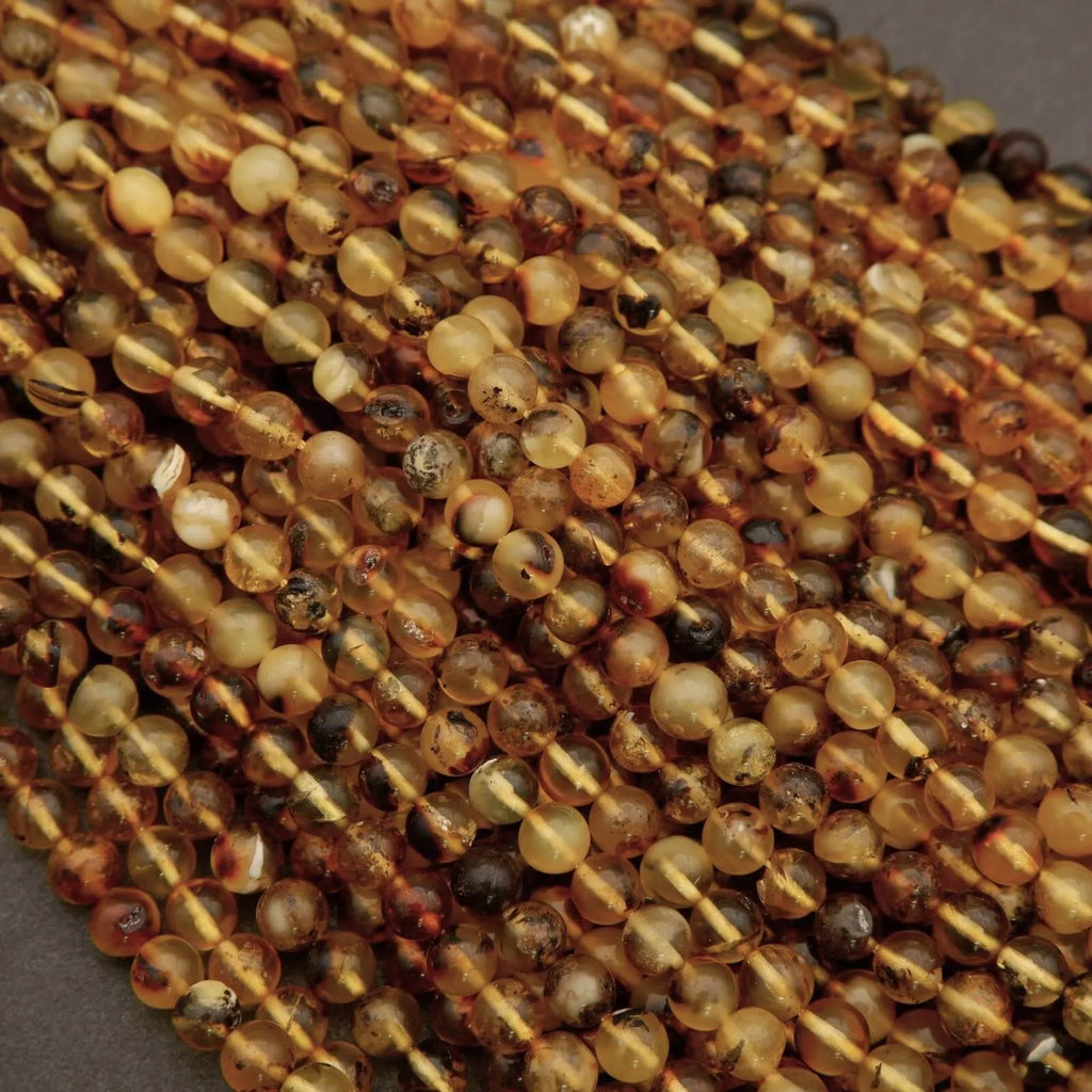 Close-up of amber-colored beads on a string