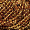 Close-up of amber-colored beads on a string