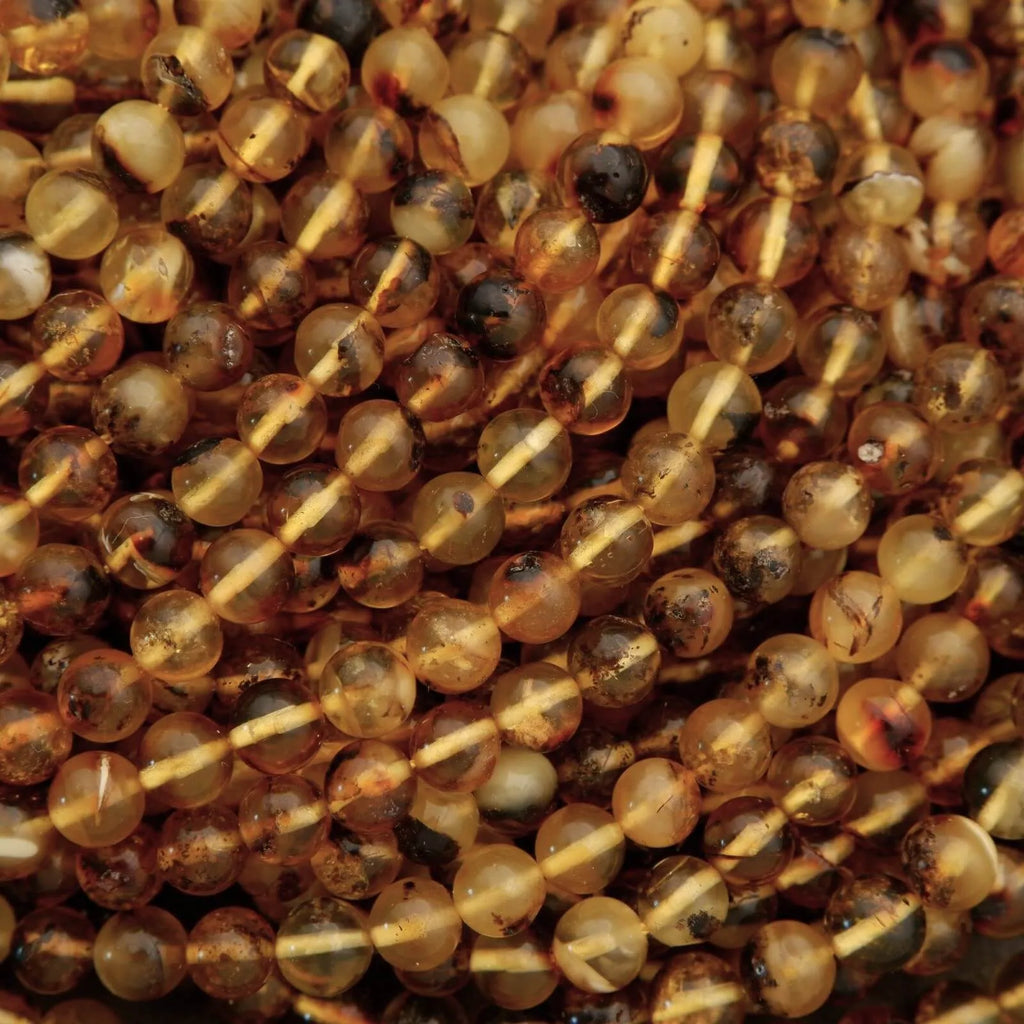 Close-up of amber-colored beads on a string