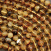 Close-up of amber-colored beads on a string