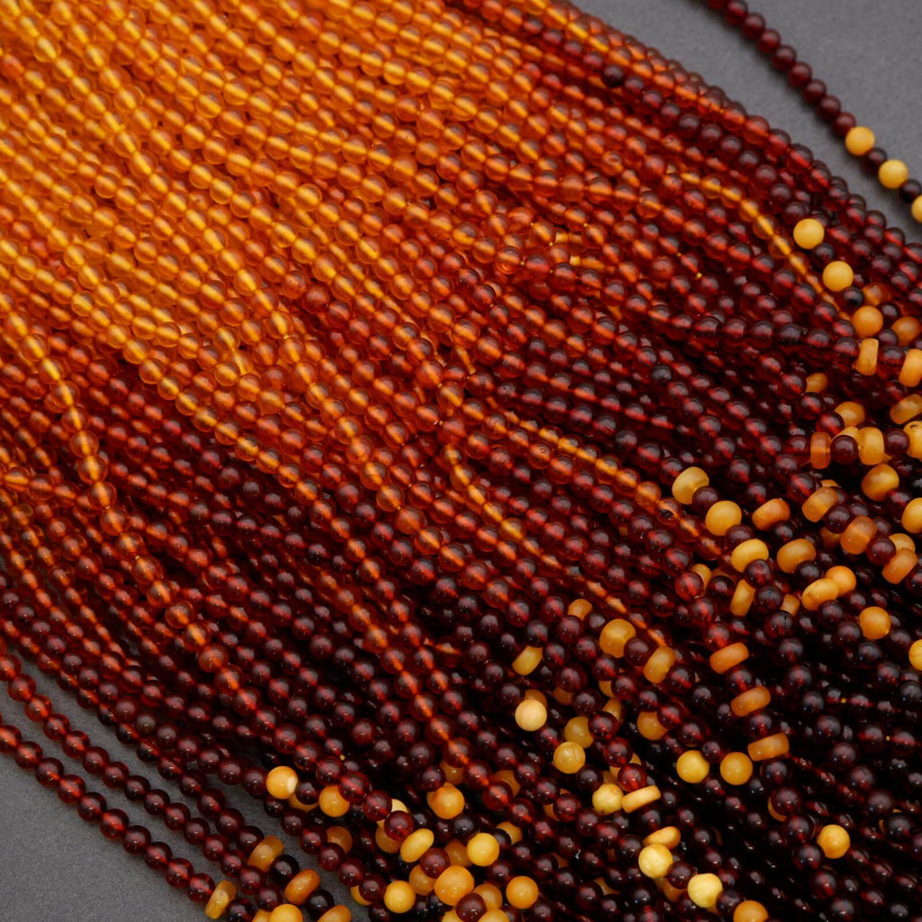 Close-up of red and yellow beads on a dark background