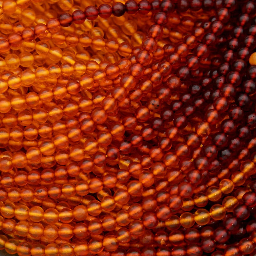 Close-up of amber-colored beads in a spiral pattern