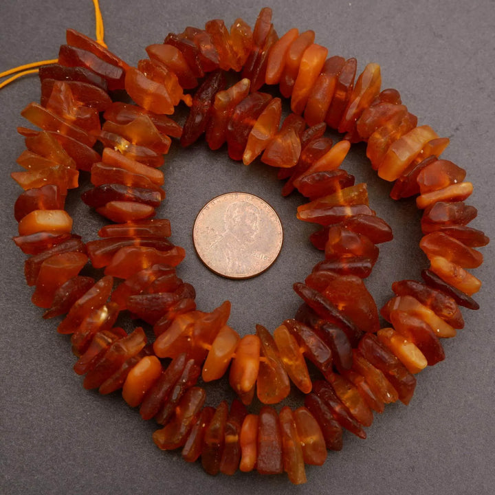 Brown chunky beads on a string.