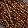 Close-up of brown beads on a gray background