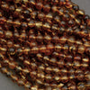 Close-up of a string of brown beads on a gray background