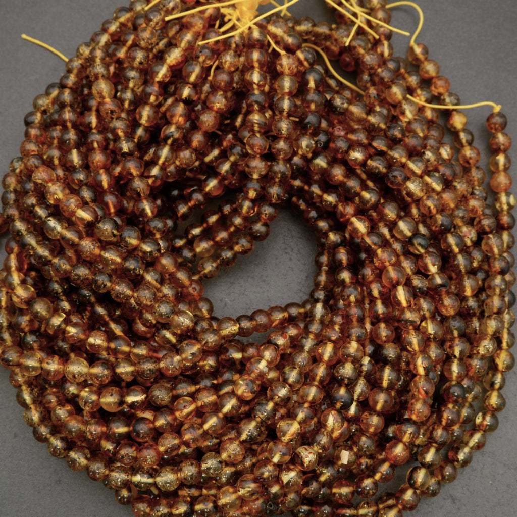 Coiled string of brown beads on a gray background