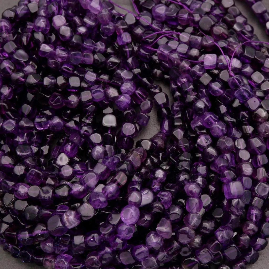 Close-up of purple beads on a string