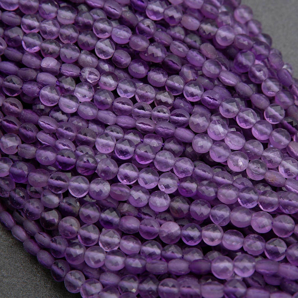 Close-up of purple beads on a gray background