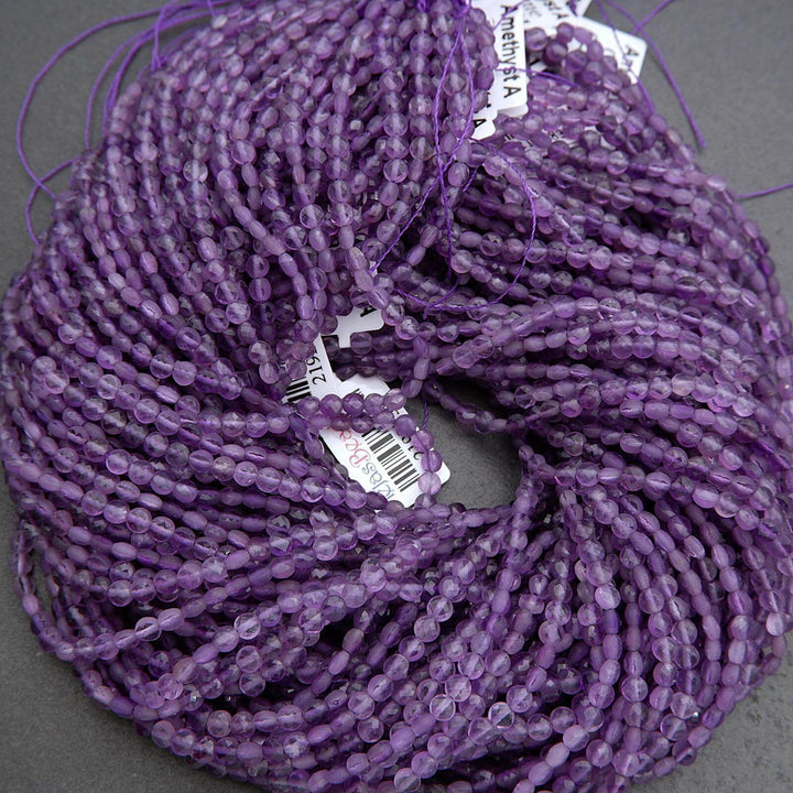 Purple faceted coin shape beads.