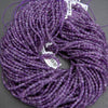 Purple faceted coin shape beads.